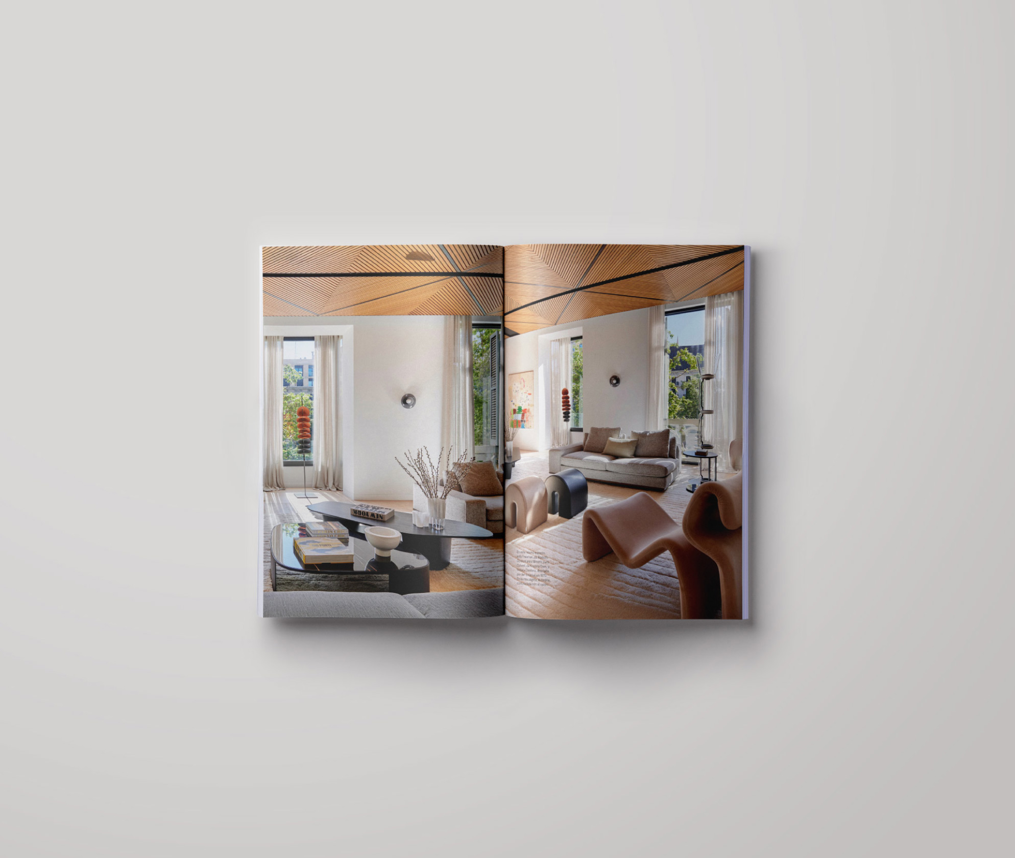 Open-plan living room designed by LUV Studio, featuring a sculptural wooden ceiling, soft neutral seating and large windows bringing in natural light.